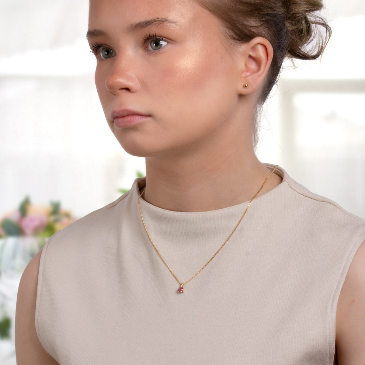 Model wearing a small gold tourmaline necklace, October birthstone, PRE4002-tur
